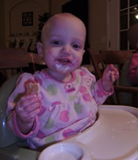 Grand-daughter Lily with frosting on her face Grand-daughter Lily with frosting on her face